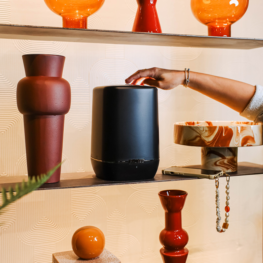 The One scent device elegantly placed in a modern interior setting, delivering a subtle scent experience via our scent system.