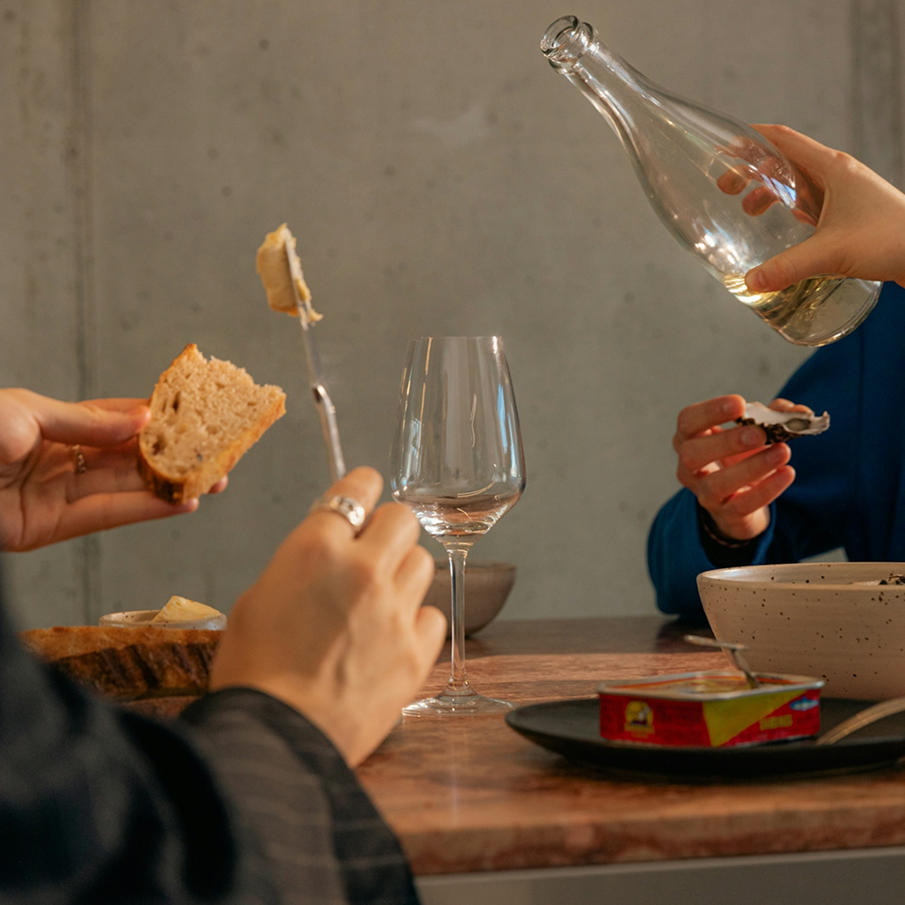 Group of friends enjoying a dinner together in a restaurant with a warm and inviting scented atmosphere