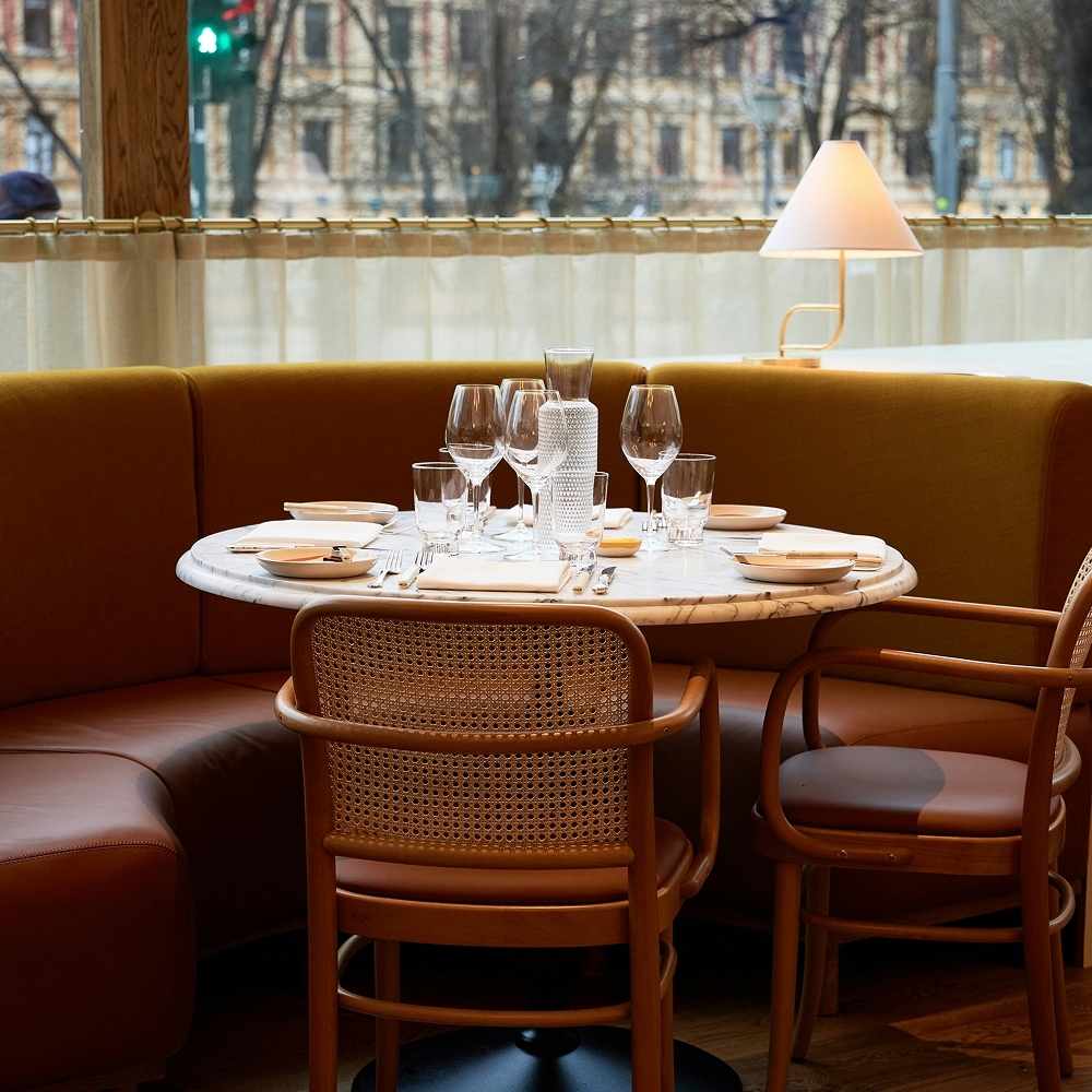 Elegant restaurant interior setting with carefully designed lighting and decor, enhanced by subtle ambient scents