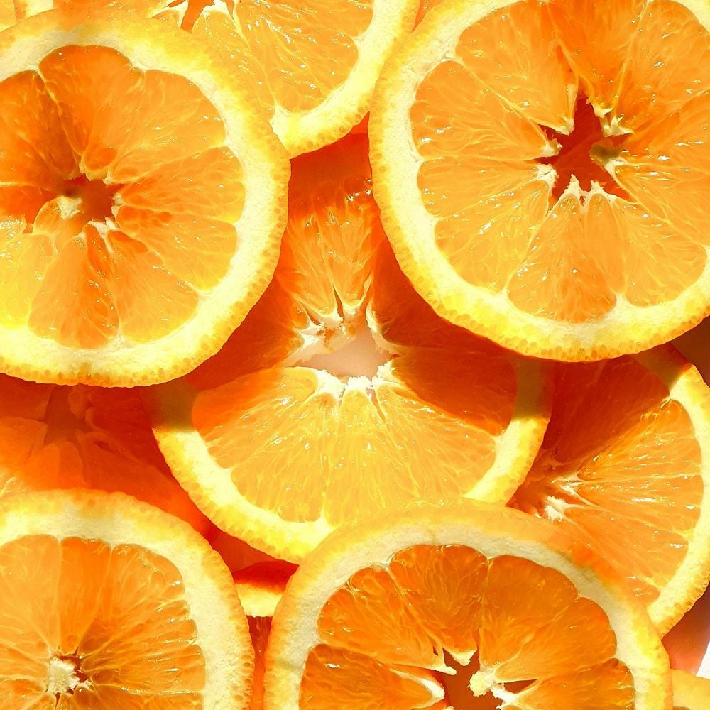 Orange slices representing an energizing citrus scent for gym environments.