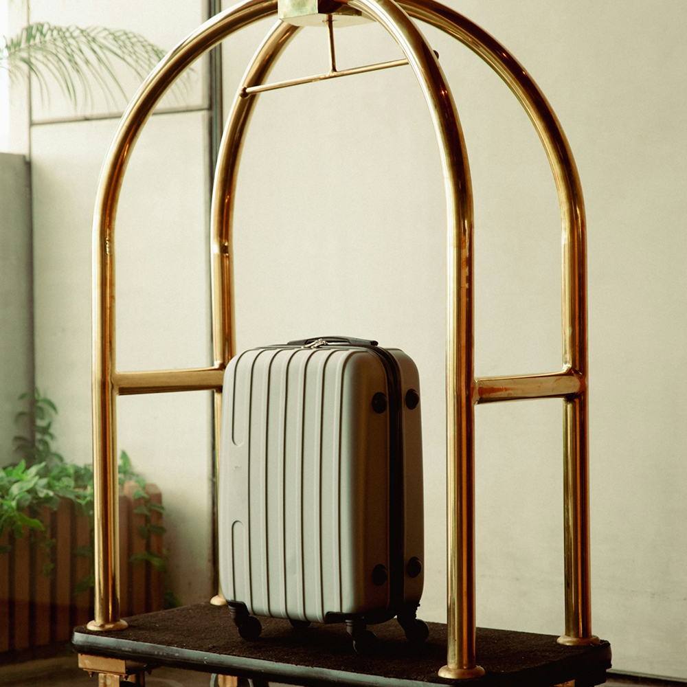 Suitcase in luxurious and fresh-looking hotel lobby