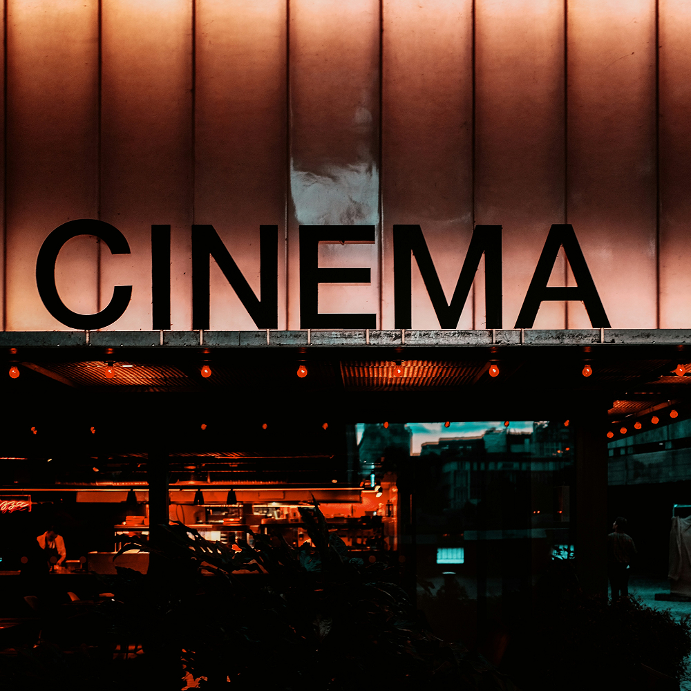 Cinema building with illuminated signage at night