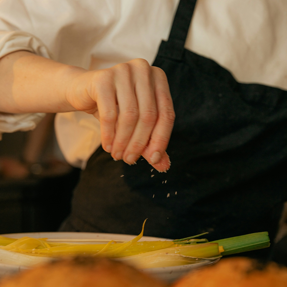 Chef preparing dishes in kitchen, supported by scent for a full flavor experience