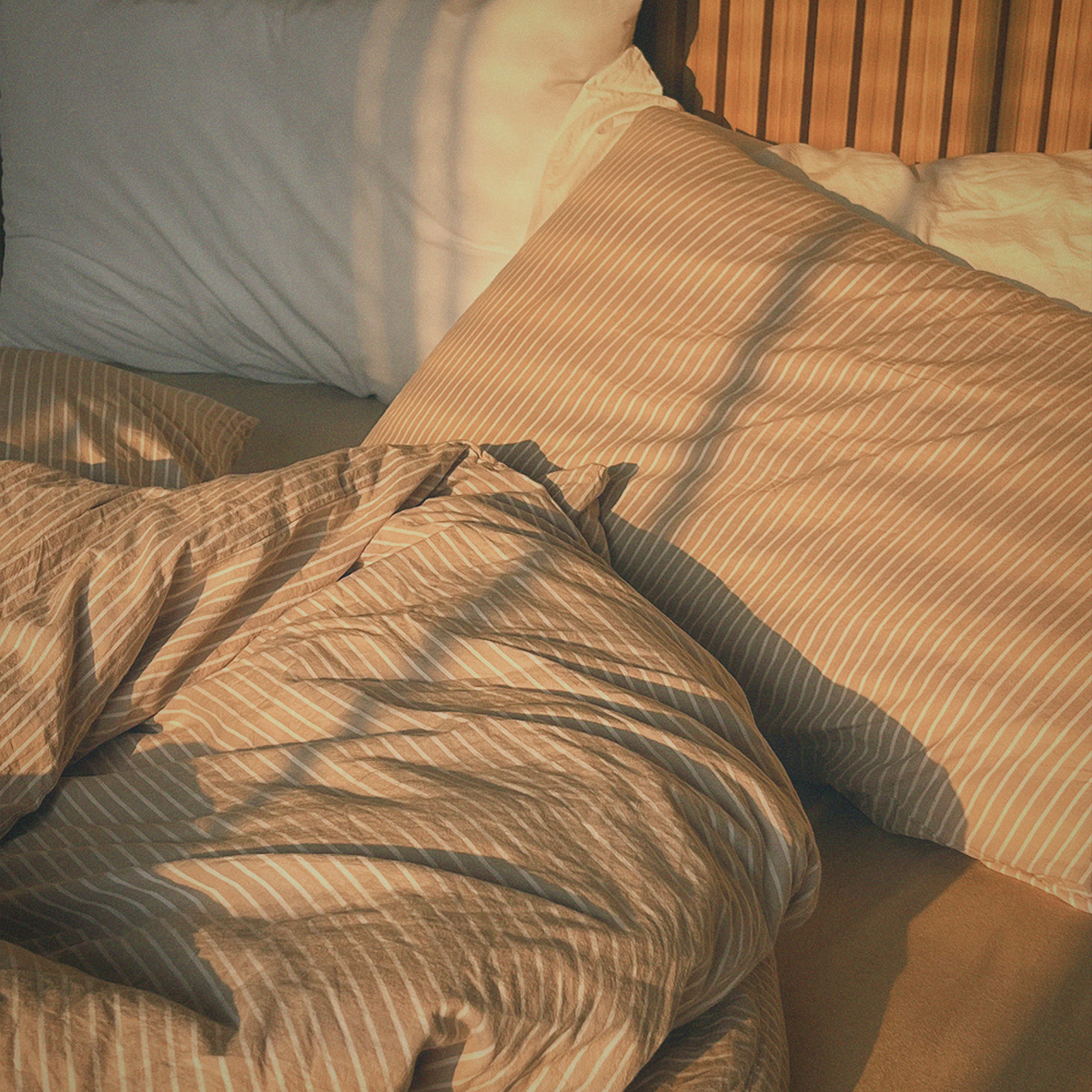 Comfortable bed radiating tranquillity with calming scent experience.